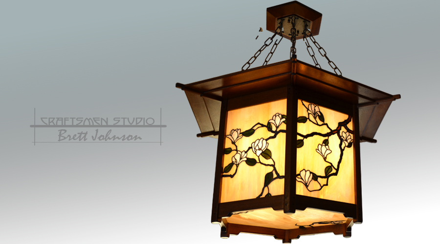 Greene and Greene style chandelier featuring hand-leaded magnolia glass and mahogany construction.