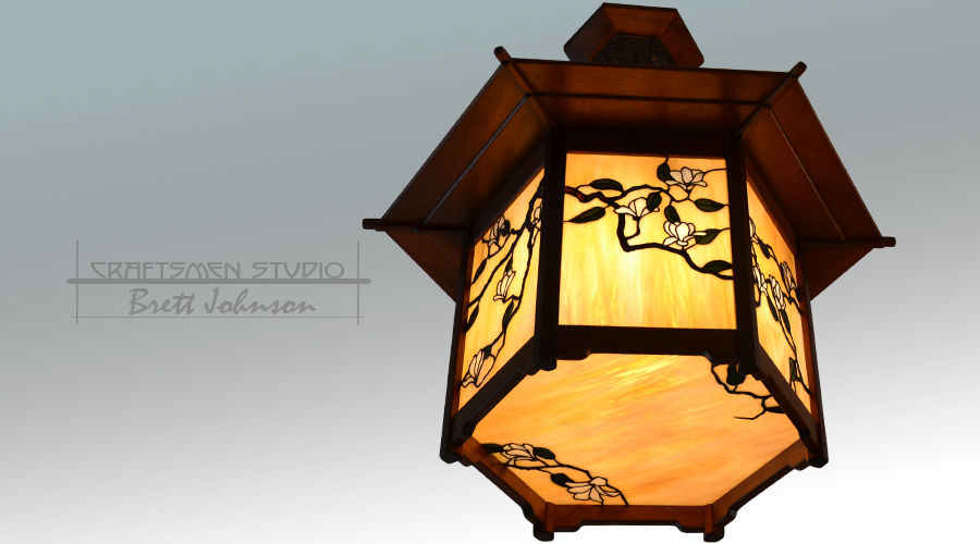 Hillcrest Chandelier – Greene and Greene inspired hexagonal Arts and Crafts chandelier with handcrafted magnolia design stained glass.