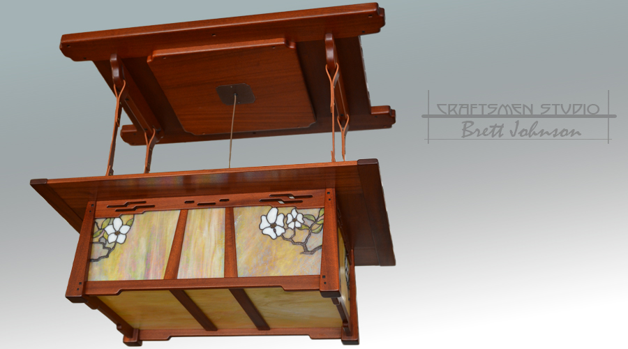 La Jolla Chandelier in the Arts and Crafts tradition, featuring tapered joinery and handcrafted stained-glass lighting.