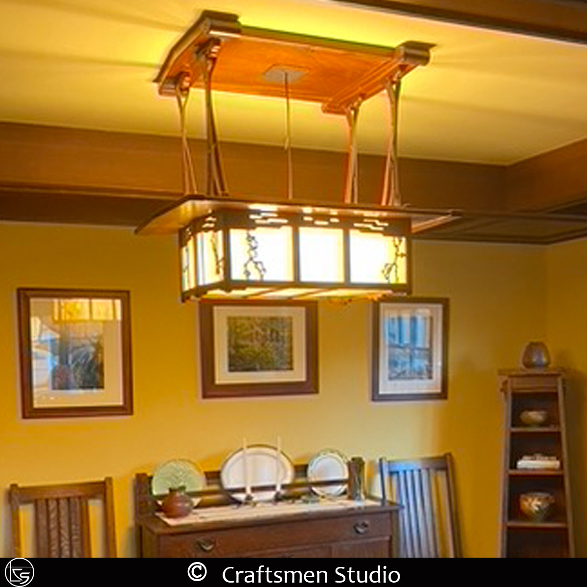 Greene and Greene lighting inspired by the Pratt House featuring mahogany, stained glass, and leather suspension straps.